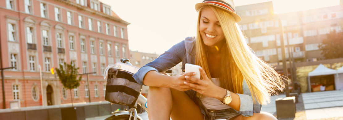 woman out on a bike ride taking a break to play online casino games at Jackpot Capital