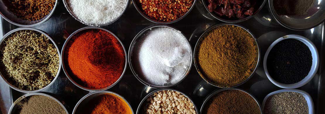 an array of herbs and spices on the table