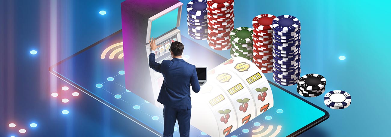 businessman at a giant smartphone with an online casino on the screen. There are casino chips at the side of the smartphone.